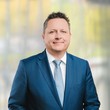 Auf dem Bild ist Dr. Benedikt Schreiner zu sehen.