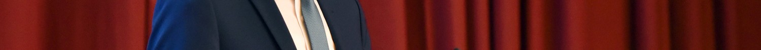 Matthias Münning steht an einem Rednerpult und hält einen Vortrag. Quelle: © BAGüS